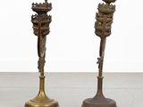 pair of antique brass candlesticks on cast iron wheels