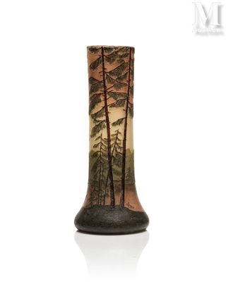 a vase that has a picture of a forest on it