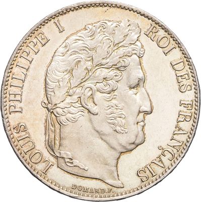 a close up of a coin with a man ' s face on it
