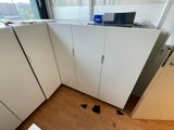 a picture of a kitchen with a lot of cupboards in it