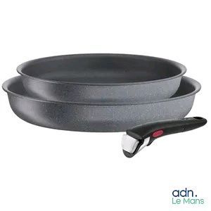 two pans and a knife on a white background