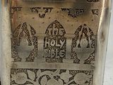 a silver box with a design on it