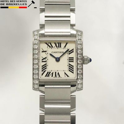 a silver watch with roman numerals on the bracelet