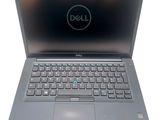 the dell laptop is open and ready to be used