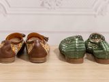 three pairs of women ' s shoes are lined up on a table