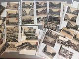 a lot of old postcards sitting on a table