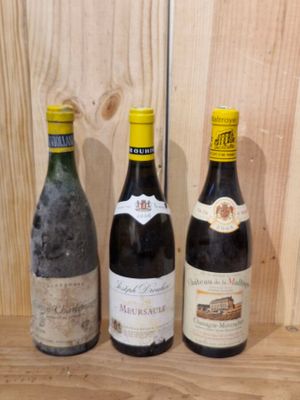 three bottles of wine sitting on a shelf next to each other