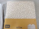 a box of cotton on the floor next to a box of tissue