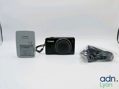 a camera and a charger sitting next to each other on a table