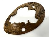 a metal plaque with a picture of a tree on it
