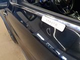 a picture of a car with a sticker on it ' s door