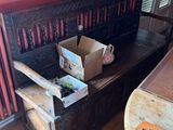 a wooden bench with a box on top of it