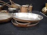 many pots and pans that are on a table