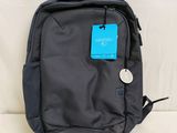 the back of a black backpack with a blue tag on it