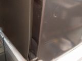 a microwave that is sitting on top of a refrigerator
