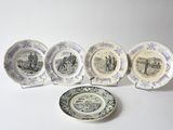 several plates and a plate with a picture of people on them