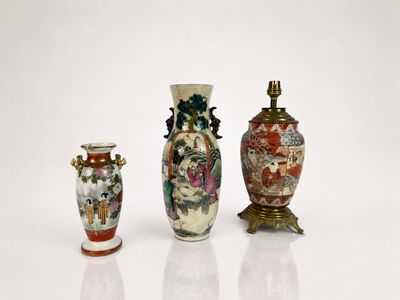 three vases are sitting next to each other on a white surface