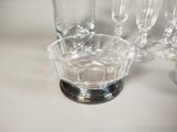 a lot of wine glasses sitting on a table