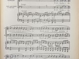 an old book with a page of music written in it