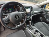 the interior of a car with a steering wheel and dashboard controls
