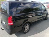 a black van that is parked in a parking lot
