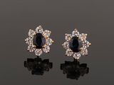a pair of sapphire and diamond earrings