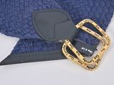 a belt that has a buckle on it and a pair of scissors