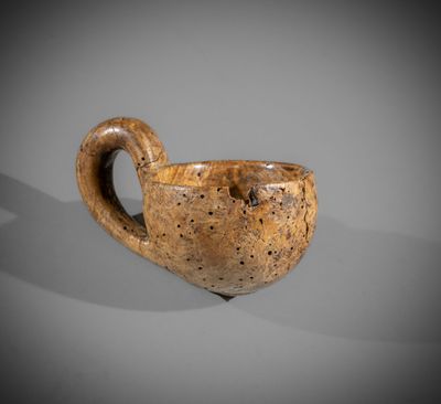 an image of a cup with a handle on a table