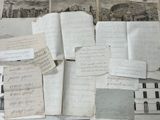 a pile of old papers on a table