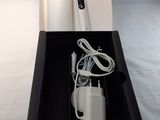 a black box with a white electric toothbrush inside of it