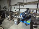 a man that is working on a machine in a garage