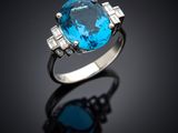 an oval blue topaze and diamond ring