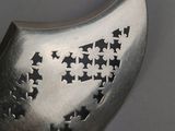 a metal object with stars on it on a table