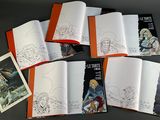 a lot of books that are on a table