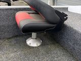 a black and red seat on the back of a boat