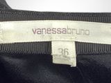 an image of a label on the back of a black dress