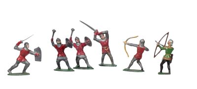 several figurines of knights with bows and arrows on a white background