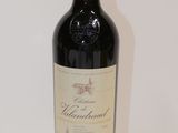 a bottle of wine that is sitting on a table