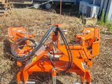 a close up of a machine that is sitting in the grass