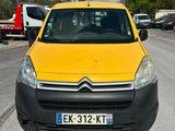 a small yellow van parked on the side of the road