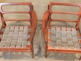 pair of mid century danish teak chairs with woven seat cushions