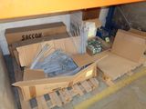a cardboard box with a bunch of screws on top of it
