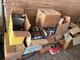 a pile of boxes and cans sitting on a carton