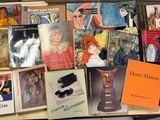 many books that are on a table together