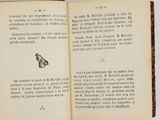 an open book with a drawing of a butterfly on it
