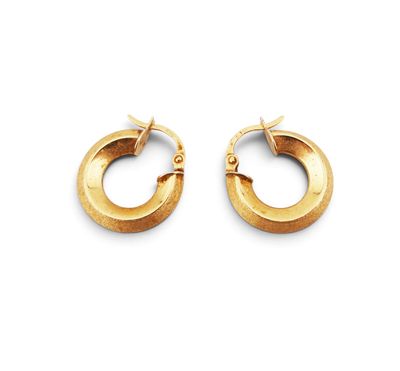 pair of gold hoop earrings on a white background