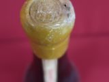 a close up of a glass of orange juice on a table