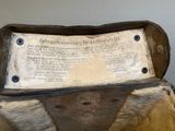 a wooden box with a sign on it sitting on a table