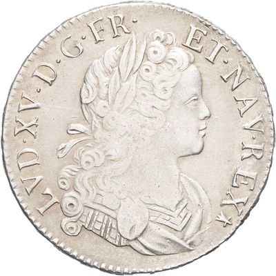 a close up of a silver coin with a woman ' s head on it