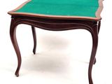 a small table with a green cloth on top of it